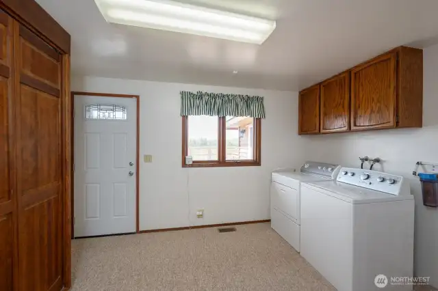 Utility Room with access to deck and pool