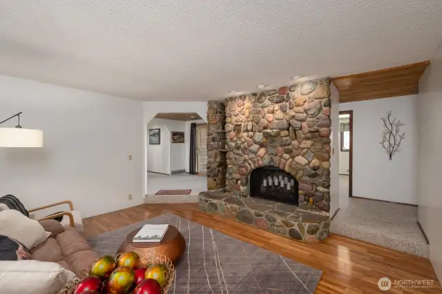 Living room with river rock fireplace