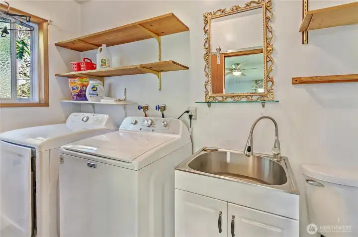 View of the 1/2 bath and laundry room.