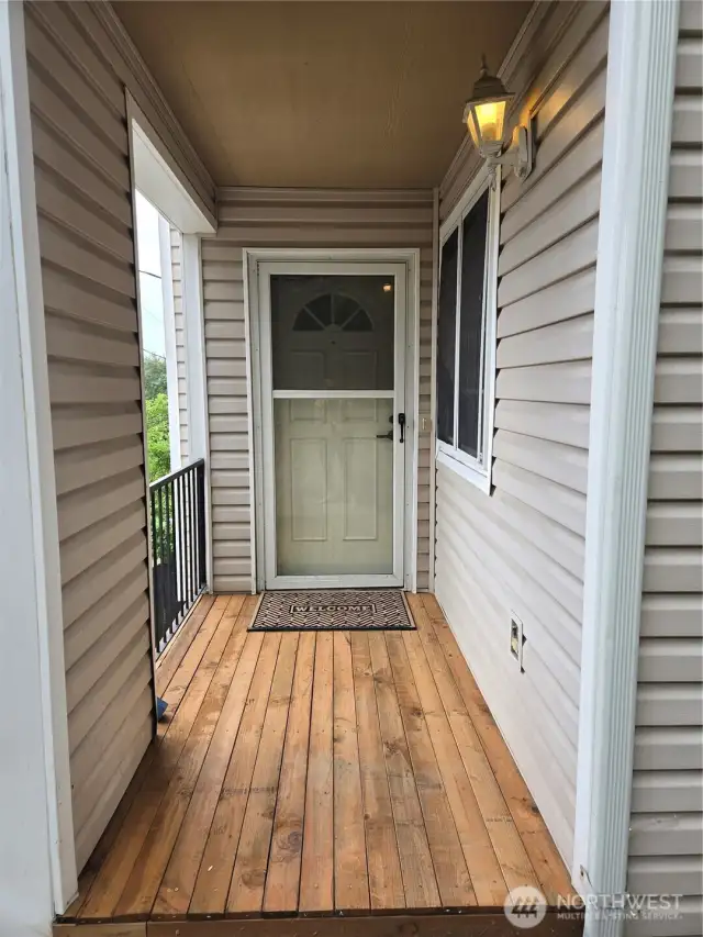 The front porch was just replaced with new wood.