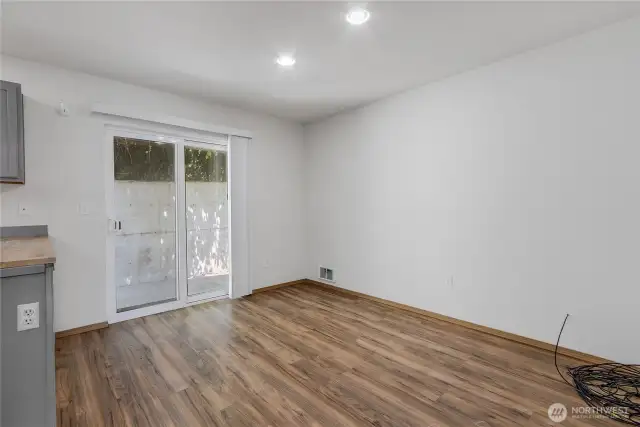 Dining Area off of the kitchen. Slider leads to the back patio area.