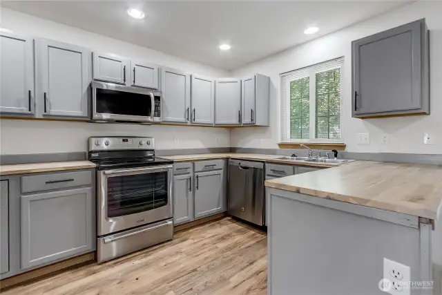 Remodeled Kitchen with Stainless appliances & Butcher Block Counters.