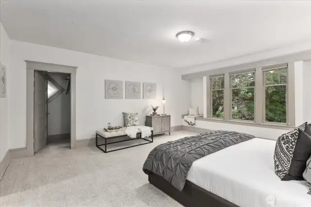 Oversized bedroom with window seats and two closets.  Plenty of room to add a bathroom and turn into a primary suite.