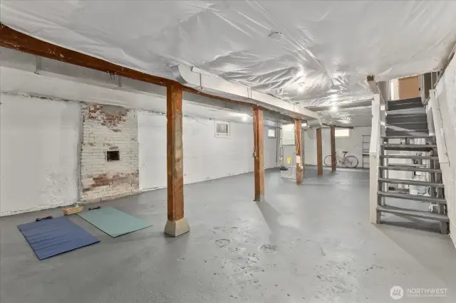 Large basement with high 8' ceilings, and exterior door access.  Blank canvas to reimagine the space...ADU, guest suite, hobby room or home gym?