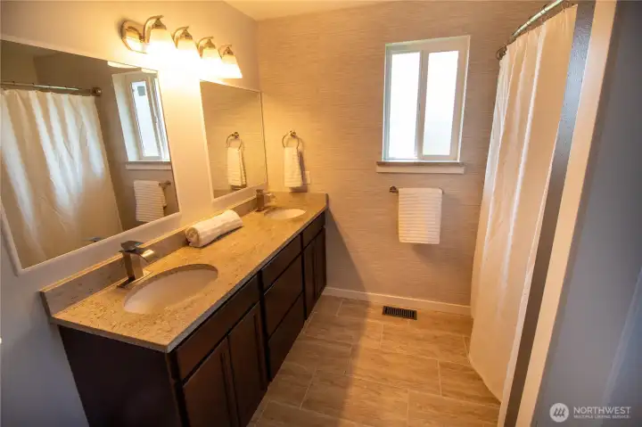 The primary ensuite features spa like upgrades & enclosed toilet room.