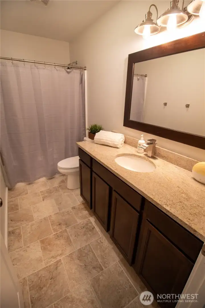 This beautiful bathroom sits conveniently between bedrooms 2 & 3!
