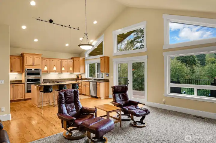 The vaulted ceiling great with an open floorplan, is the heart of this home. The huge window wall fills the space with light and brings in the territorial view.