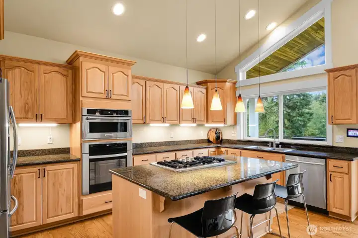 The kitchen has everything you could need! Enjoy the cooking demonstrations from the breakfast bar.