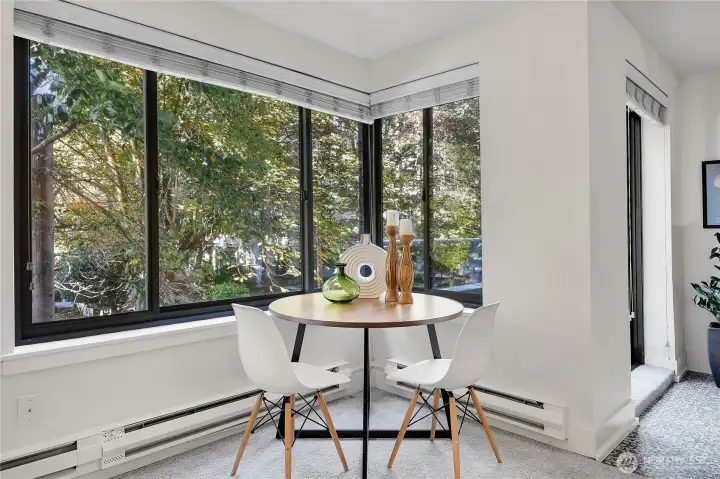 Sit at your dining table and gaze through the trees down Spring St.
