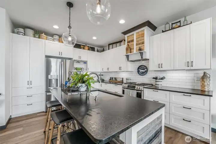 An entertainer’s dream!  Open to the living and dining space and the expansive deck that runs the length of the house.