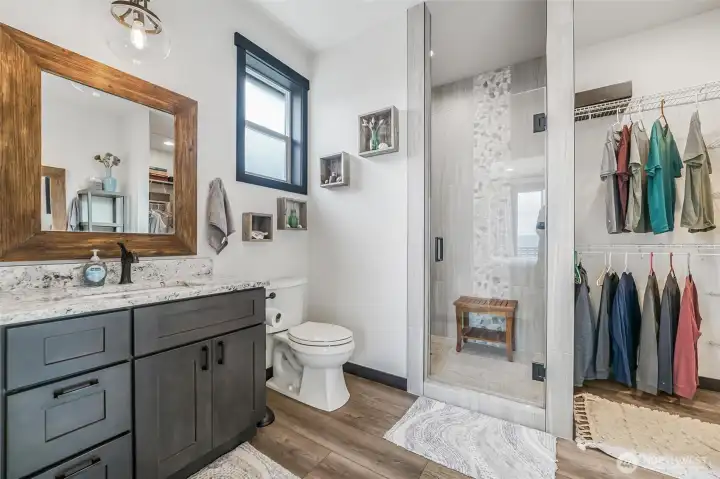 Double sinks, oversized luxury shower and a walk-in closet are all features of the primary bedroom.