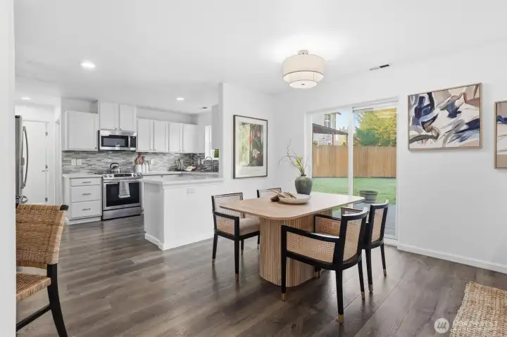 Dining area conveniently located next to kitchen and open to living area.