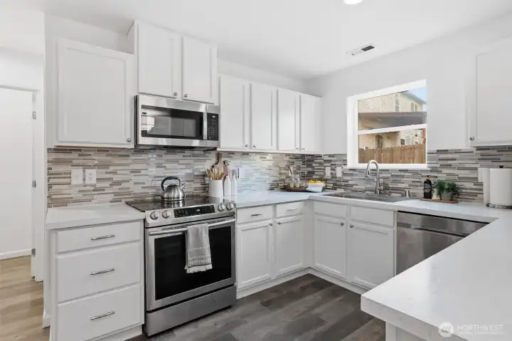 Plenty of counter space, stainless steel appliances and freshly painted cabinets.