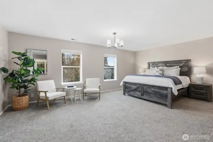 Spacious primary suite with enough room for a seating area.