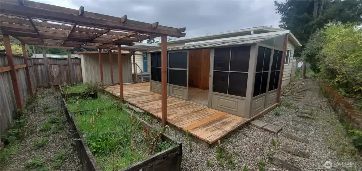 Low maintenance landscaping with raised garden beds.
