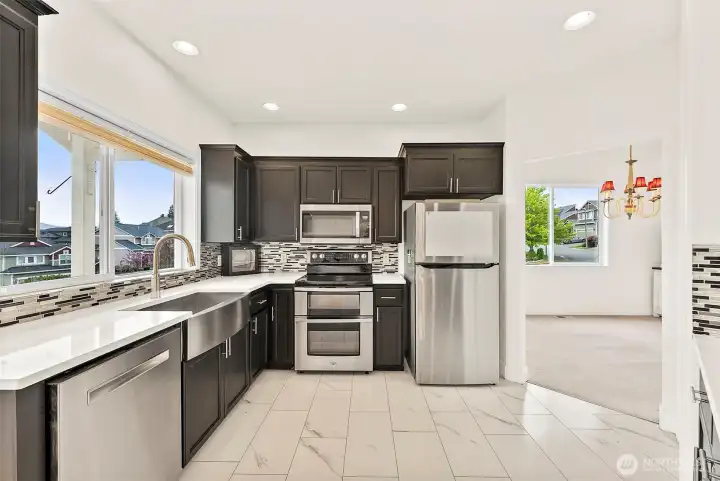 Beautifully updated kitchen with stainless steel appliances and a double oven.