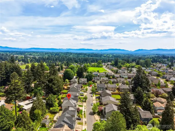 Wide aerial perspective showing the Kent area, nearby amenities, and easy access to major routes and shopping.