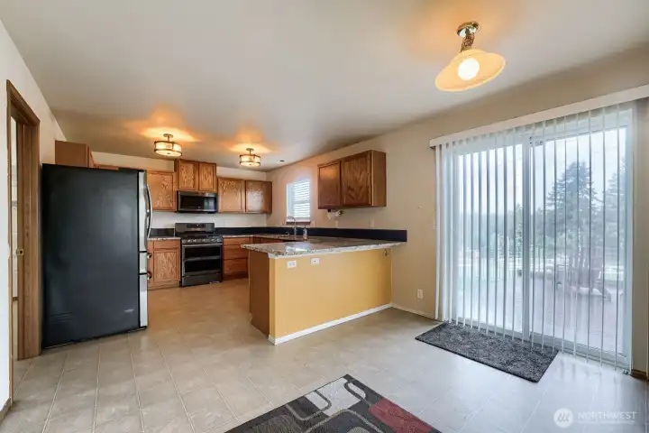 Kitchen with eating space & slider to deck