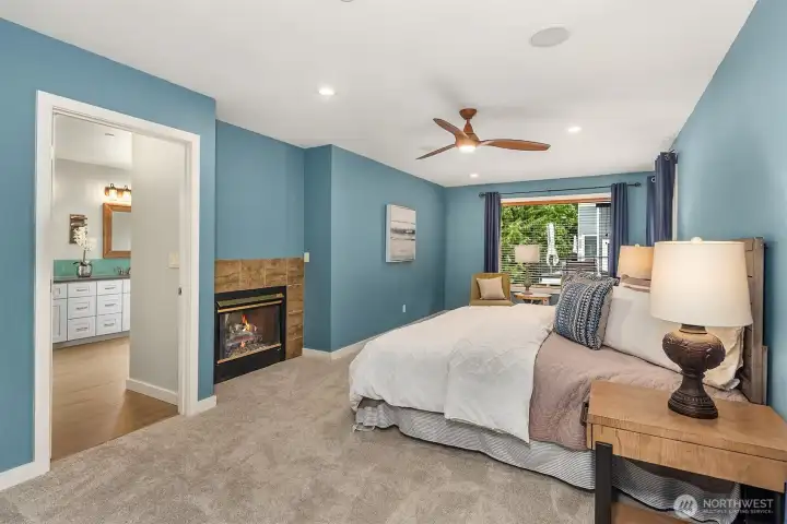 The primary suite features a gas fireplace shared between the bedroom and bathroom — a cozy and luxurious touch. The primary suite features a gas fireplace shared between the bedroom and bathroom — a cozy and luxurious touch.