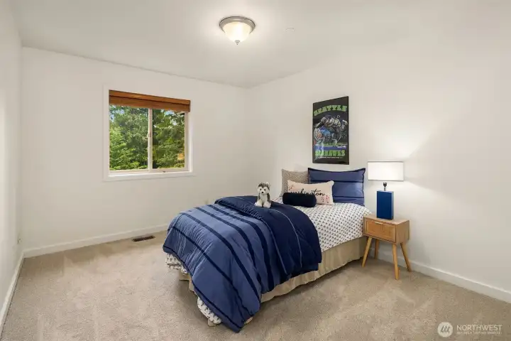 The third upper level bedroom, also with new carpet and backyard views. The third upper level bedroom, also with new carpet and backyard views.