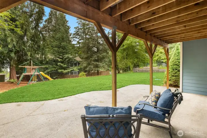 The large patio is accessed from the lower level bonus room and overlooks the park-like backyard. The large patio is accessed from the lower level bonus room and overlooks the park-like backyard.
