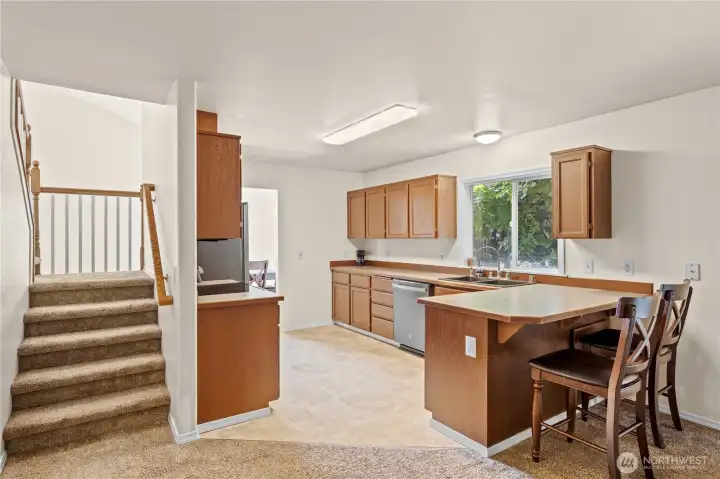 Kitchen and stairs taken from family room area