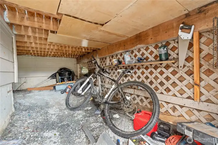 Storage located under the front porch. Has a door for easy access