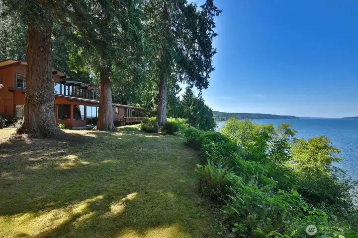 Perched amongst cedars and firs with sweeping views of Saratoga Passage and the Cascades on 1.3 acres of privacy within a half mile of Langley Village. **Check out the video**Open House Sat/13th from 11-2.