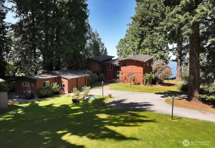 View from the south. 2 Car Garage with attached office. Level spacious yard with plenty of space for a potential ADU or additional outbuildings. **Please drive slowly on Brackenwood Ave**