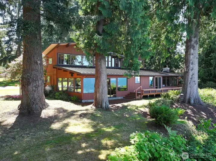 Northside of home with more windows. There is a view from almost every room! Glass doors to the left are to the Family Room and glass doors to the right are to the Living Room.