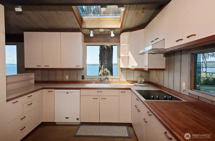 Excellent Kitchen Sink view! Your back is to the Dining Room. The floors in the Kitchen are cork.