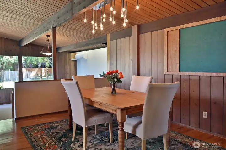 Hardwood floors continue into your Dining Room. A few steps down (along the left edge of photo) to an expansive Family Room.