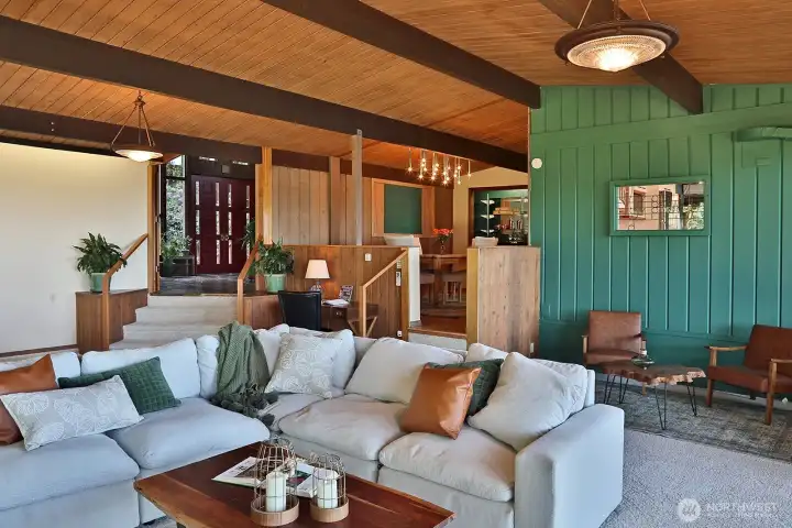 Spacious Family Room with new carpet (2026).  Open French doors bring you back to the atrium.