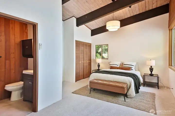 West side Primary Suite with new carpet. 3/4 bath and a large walk in closet (around the corner from the bathroom) in addition to a standard sized closet.