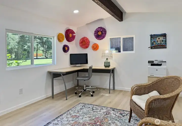 Bright spacious office attached to the garage.