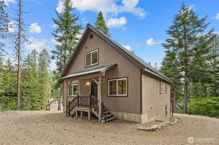 Convenient level parking area and covered front porch