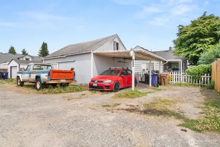 ample parking in back with detach garage
