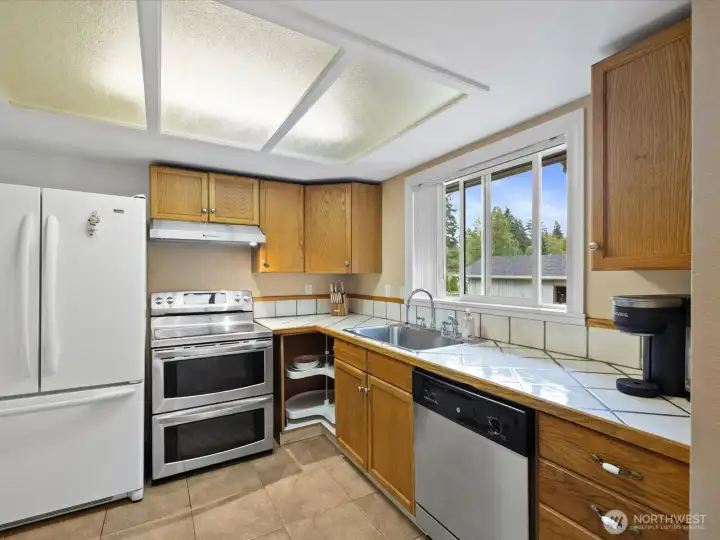 Kitchen with backyard views Kitchen with backyard views