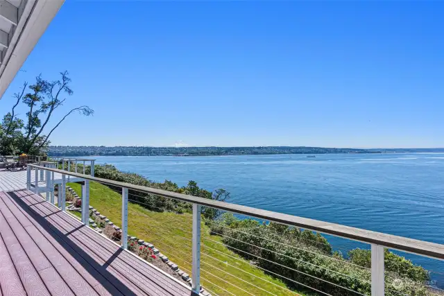 There is nothing like these views in Gig Harbor. This custom home was built to capture sunrises and sunsets with views from Mt Rainier to the majestic Olympic Mountains.