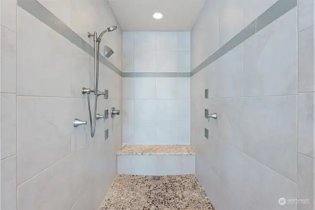 Now this is one magnificent shower. Its no-step entry is perfect for everyone. A large bench area beckons you to sit for bit and enjoy the warm water washing away the day's cares.