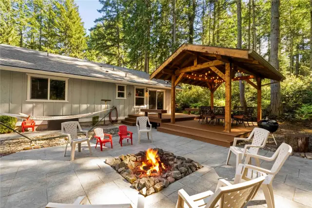 Enjoy marshmallows around the stamped concrete fire pit.