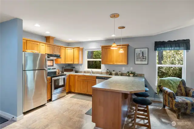 Stainless steel appliances and solid wood cabinetry.