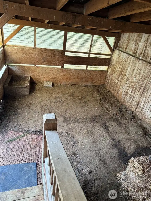 Livestock pen off enclosed porch