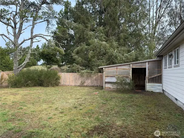 Livestock pen attached to enclosed back porch