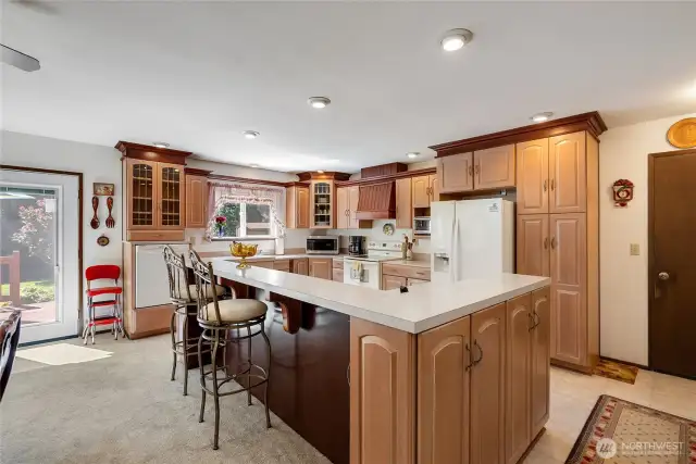 Elevated dishwasher for ergonomics, extra seating at the bar and new French doors that take you out to the deck and yard.