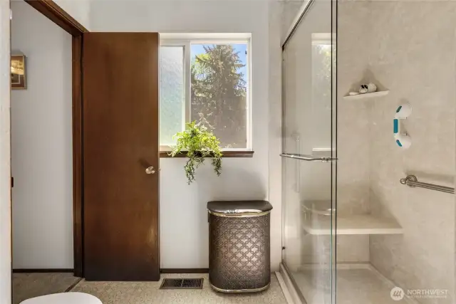Recently added walk-in shower- with safety bars and a seat for easy cleaning