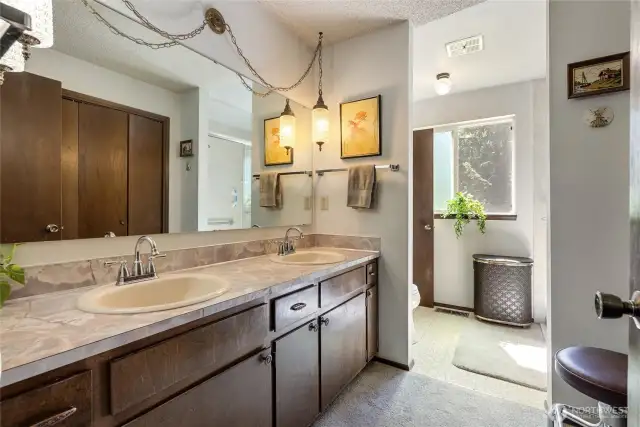 Double vanity with vintage light fixtures.  Plenty of cabinets and linen closets for all your needs