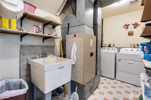 Nice utility set up with washer and dryer, sink and the home furnace