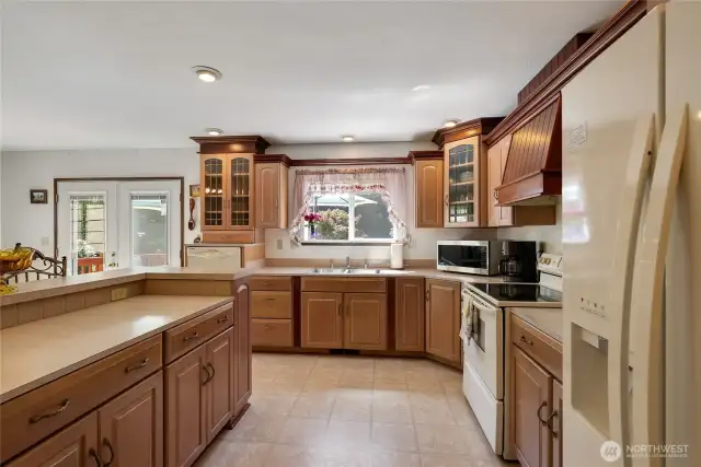 Super spacious kitchen island with convenient power plugs for your small appliances or a laptop with your recipes.