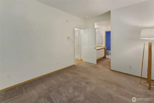 Primary bedroom with entrance to vanity